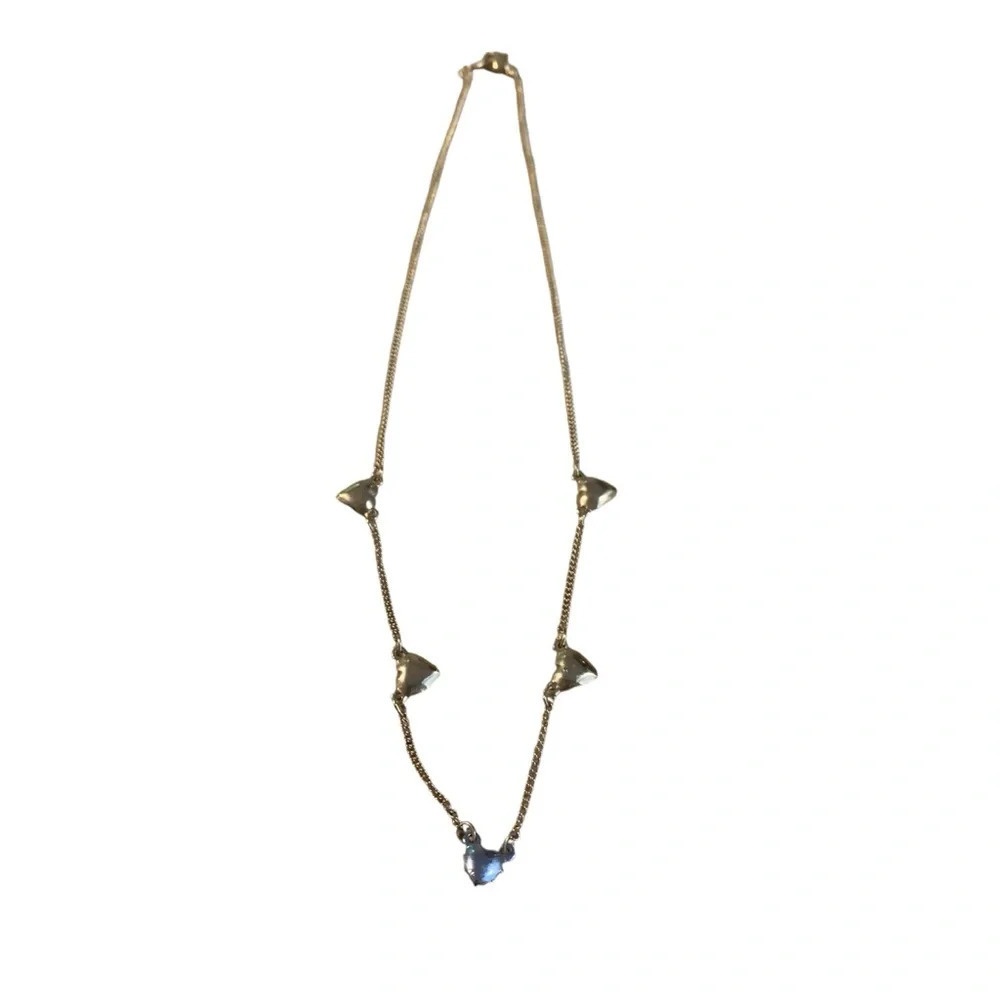 Avon heart necklace 18” length bottom heart is silver the rest are goldtone